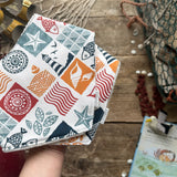 Coastal Stamps Dribble Bib