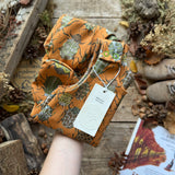 The Beetle Club Footed Romper